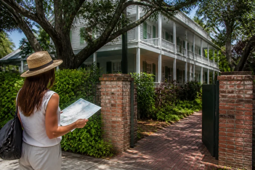 Visitor planning a walking route in Key West's historic district