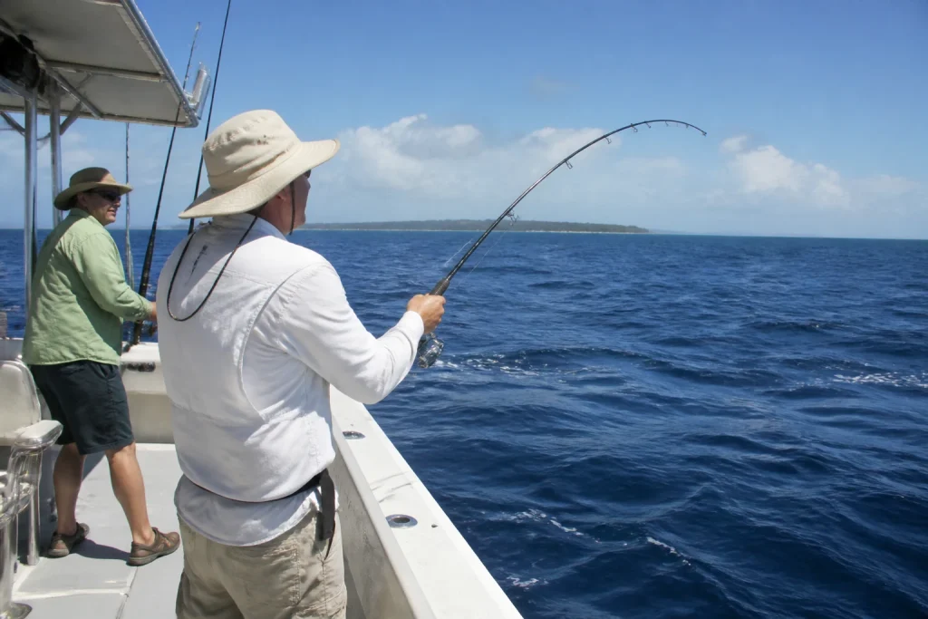 Travelers fishing aboard a small Key West charter boat