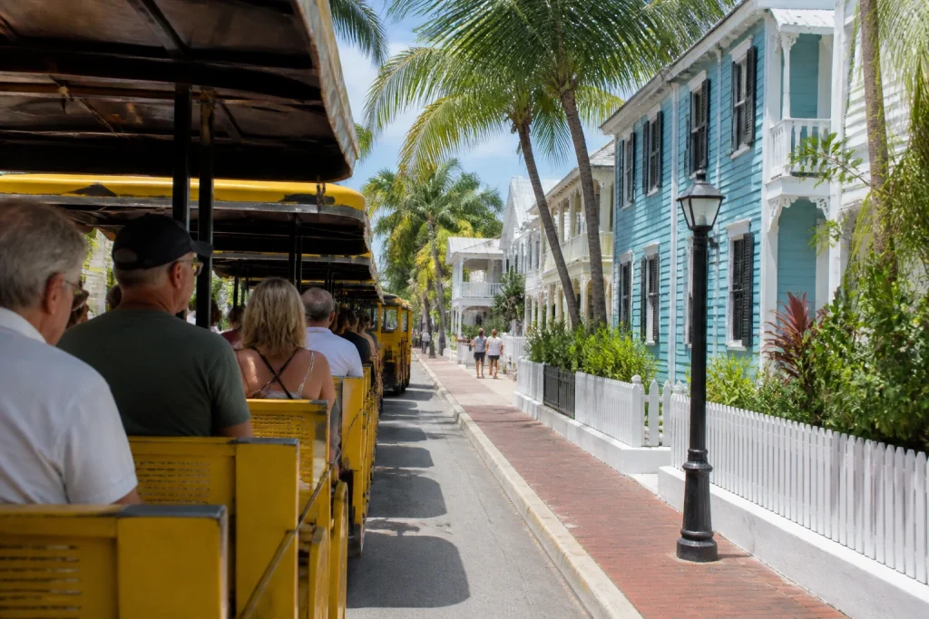 Sightseeing train traveling through Key West’s historic Old Town streets.