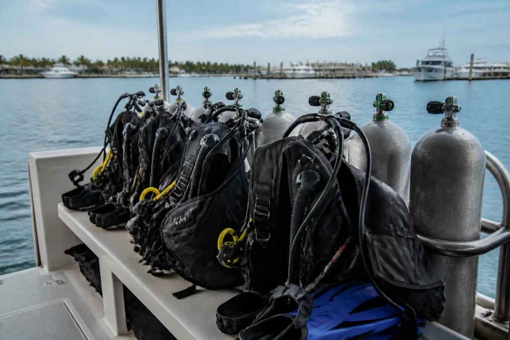 Scuba tanks and rental equipment arranged on a Key West dive boat