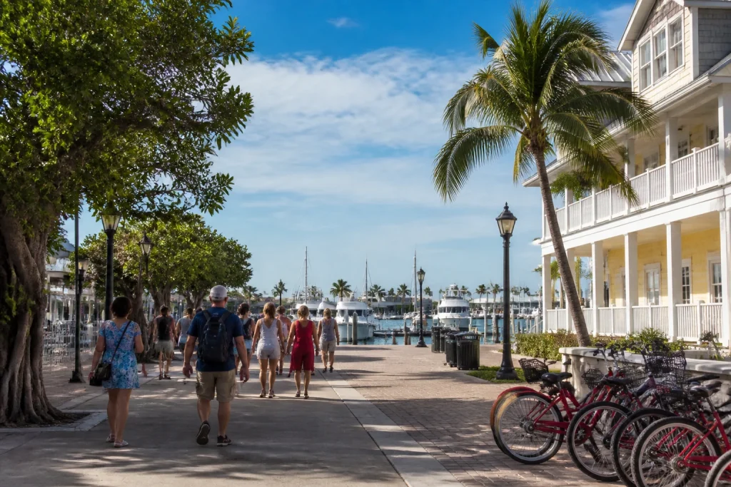 Visitors walking toward a downtown Key West marina departure point
