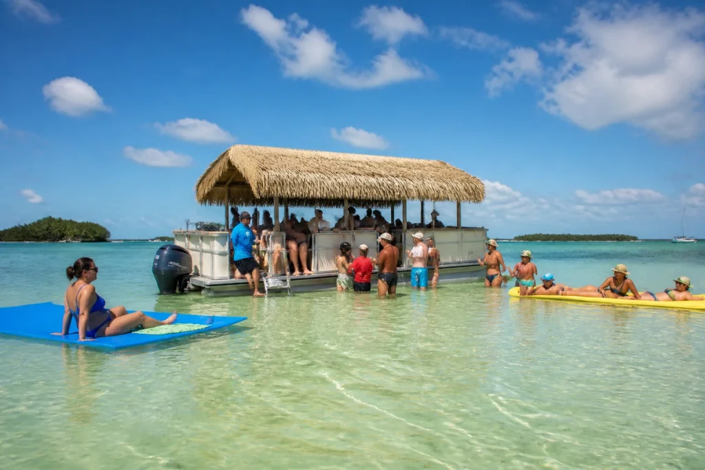 Guests wading and floating during a shallow-water charter stop