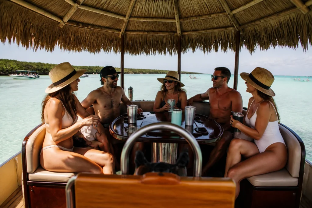 Small group enjoying a private tiki-style boat charter in Key West waters
