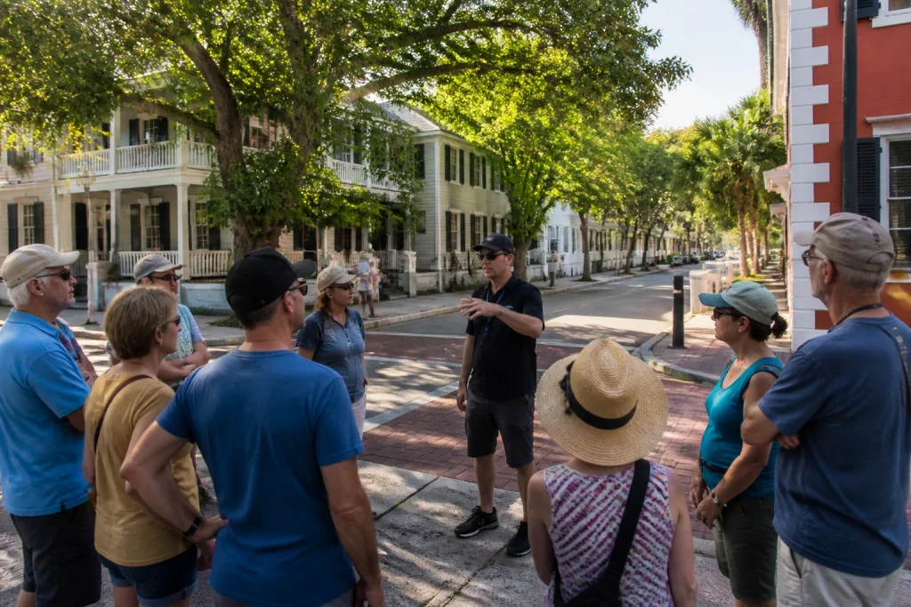 Adult walking-tour group paused on an Old Town street