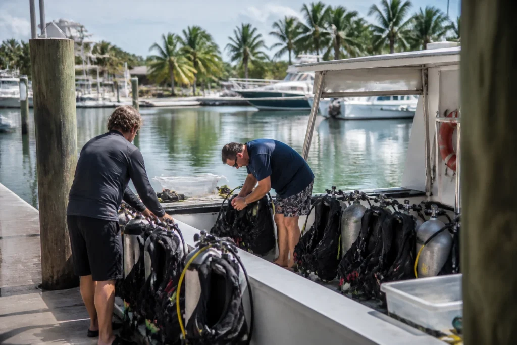 Divers preparing equipment for a morning wreck charter in Key West